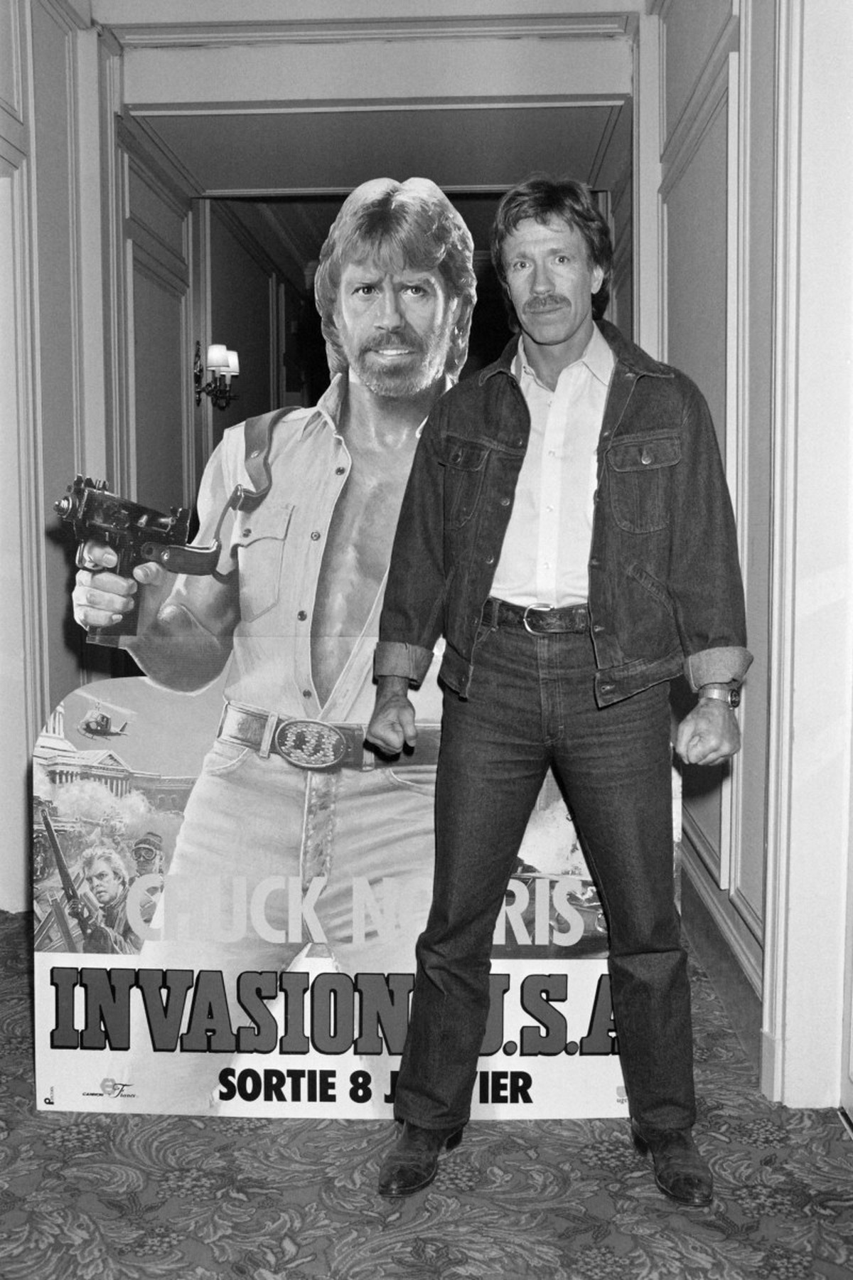 (FILES) US actor Chuck Norris poses on November 27, 1985 in front of the poster for the movie "Invasion USA" at the H�tel Plaza Ath�n�e in Paris. Chuck Norris, the US martial artist and Holl ...