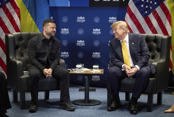 epa13098346 A handout photo made available by the Presidential Press Service shows Ukrainian President Volodymyr Zelensky (L) meeting with US President Donald Trump (R) on the sidelines of the 2026 NA ...