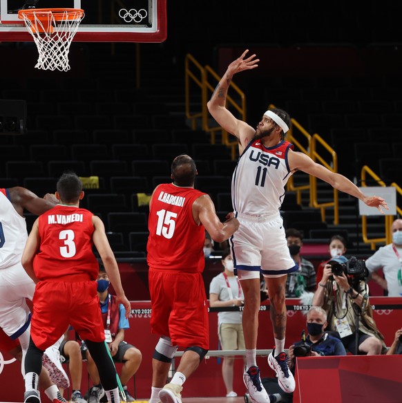 epa09372681 Javale McGee of USA (R) in action during the Men&#039;s Preliminary Round Group A match between USA and Iran during the Basketball events of the Tokyo 2020 Olympic Games at the Saitama Sup ...