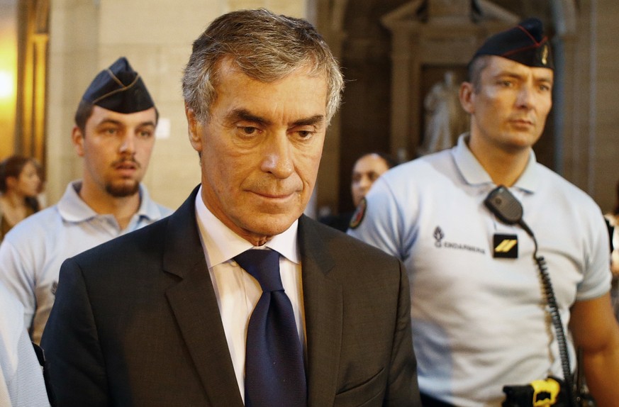 FILE - In this Sept. 14, 2016 file photo, former French budget Minister Jerome Cahuzac leaves the courthouse, in Paris. Cahuzac has been sentenced Thursday Dec. 8, 2016 to three years in prison in one ...