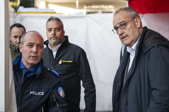 Swiss Federal President Guy Parmelin, Stephane Ganzer, State Councillor and head of the Department of Security, Institutions and Sport of the Canton of Valais, Frederic Gisler, Commander of the Valais ...