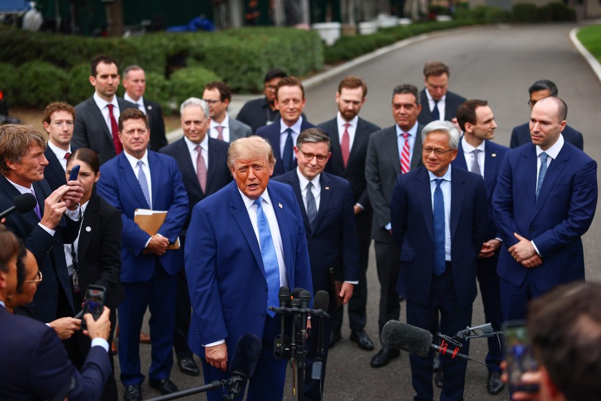 epa13271678 US President Donald Trump (C-L) speaks to reporters after a meeting on super intelligence with tech executives at the White House in Washington, D.C., USA, 29 September 2026. Facebook and  ...