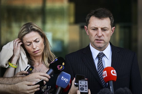 epa08463382 (FILE) Gerry McCann (R) and Kate McCann (L) the parents of the missing British child Madeleine talk to the press after a court session for the libel case against former Portuguese police c ...