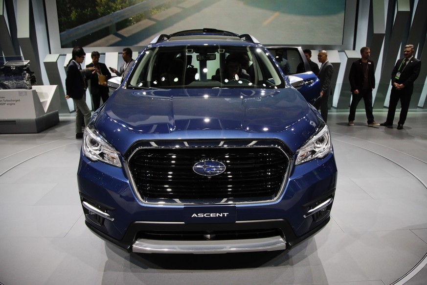 Attendees look at the 2019 Subaru Ascent at the Los Angeles Auto Show, Wednesday, Nov. 29, 2017, in Los Angeles. (AP Photo/Jae C. Hong)