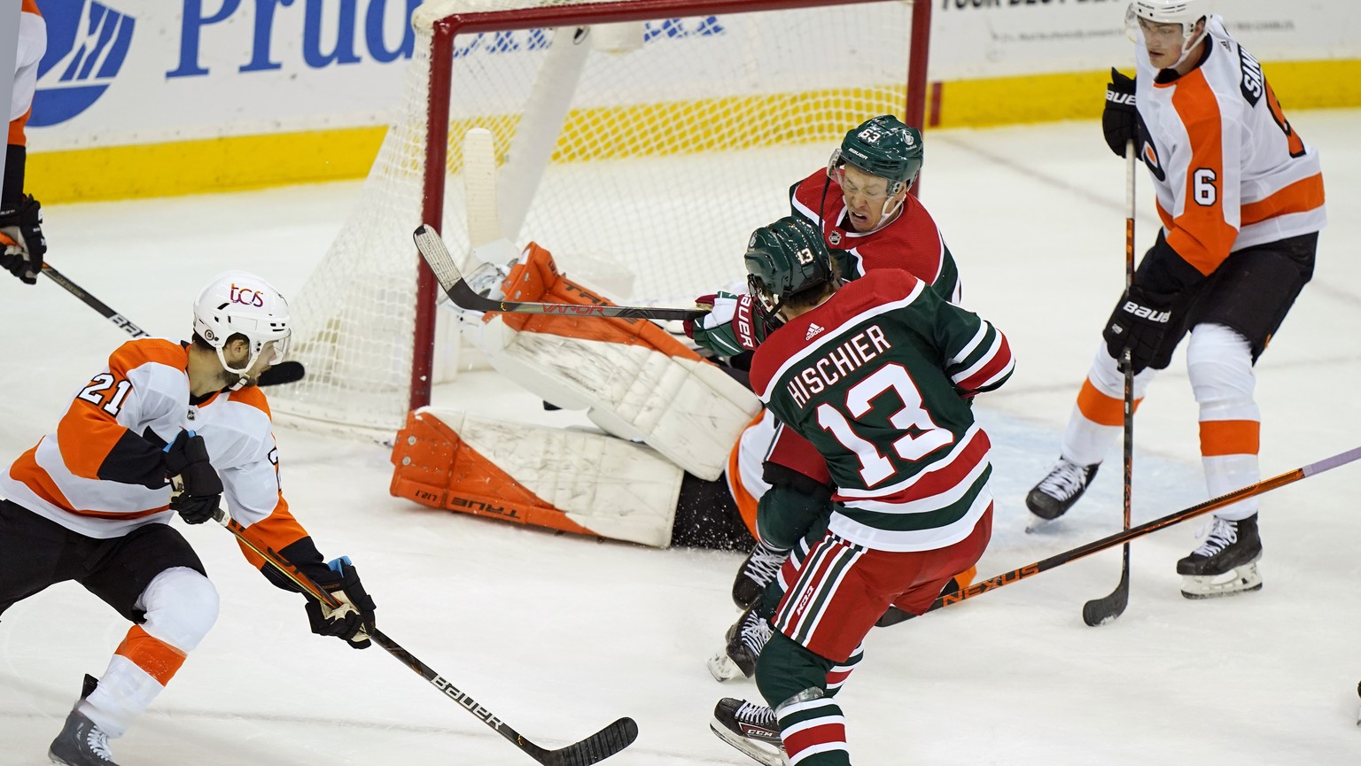 New Jersey Devils center Nico Hischier (13) takes a shot on Philadelphia Flyers goaltender Brian Elliott (in pads) with Devils left wing Jesper Bratt (63) wincing in front of Elliott on a Devils power ...