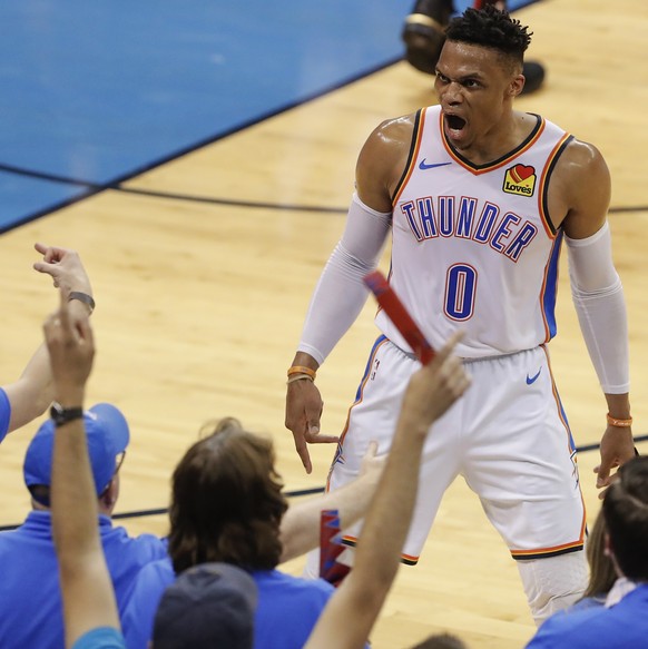 Oklahoma City Thunder guard Russell Westbrook (0) celebrates after scoring against the Portland Trail Blazers in the first half of Game 4 of an NBA basketball first-round playoff series Sunday, April ...