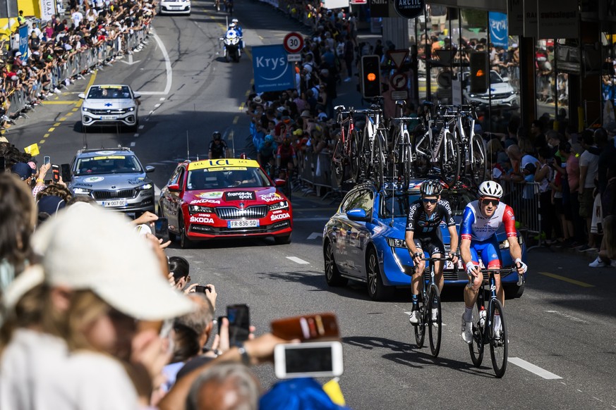 Stefan Kueng of Switzerland, right, of team Groupama-FDJ rides during the 8th stage of the Tour de France 2022 over 186,3 km from Dole in France to Lausanne in Switzerland, in Lausanne, Switzerland, S ...