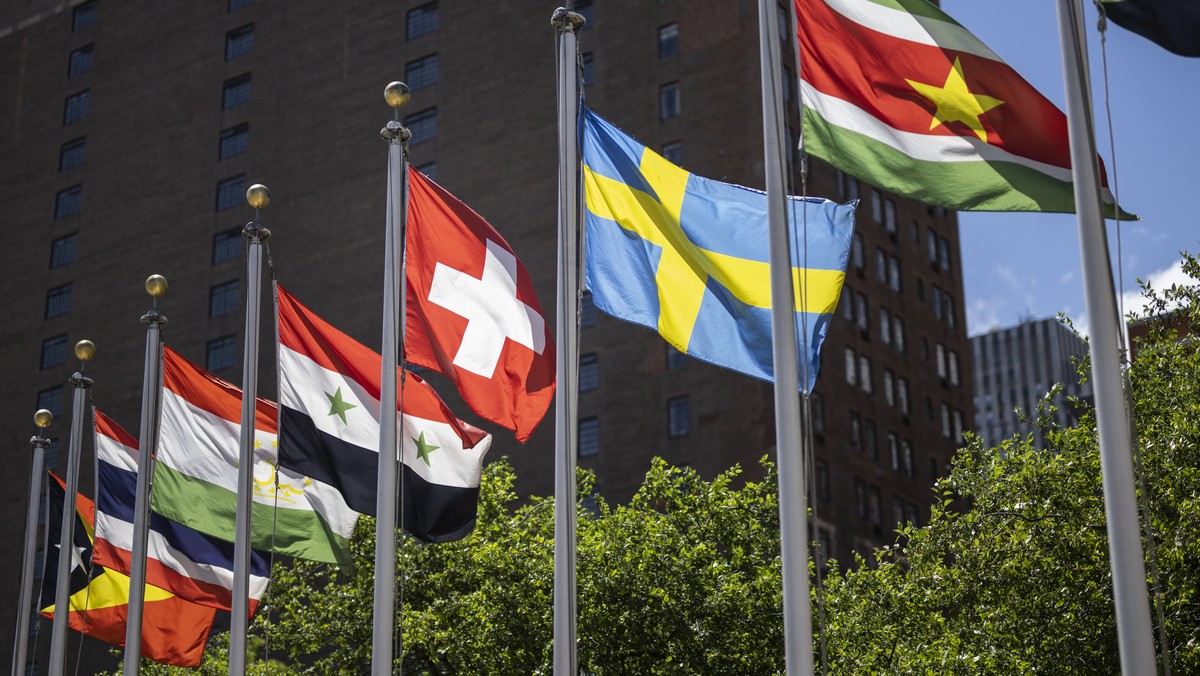 FILE - The Swiss flag, left, flies with the flags of the other member states after Switzerland's election with four other countries as non permanent members to the Security Council for the period ...