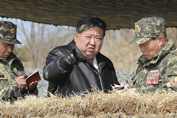 FILE - In this photo provided by the North Korean government, North Korean leader Kim Jong Un, center, supervises artillery firing drills in North Korea Thursday, March 7, 2024. Independent journalist ...