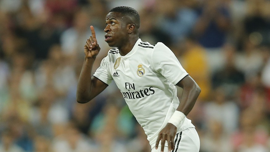 Real Madrid&#039;s Vinicius Junior gestures as he enters the pitch during a Spanish La Liga soccer match between Real Madrid and Atletico Madrid at the Santiago Bernabeu stadium in Madrid, Spain, Satu ...