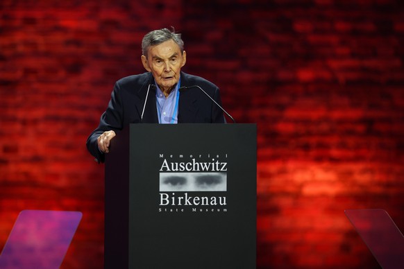 epa11856826 Holocaust survivor Marian Turski delivers a speech at a ceremony commemorating the 80th anniversary of liberation of the former German Nazi concentration and extermination camp KL Auschwit ...