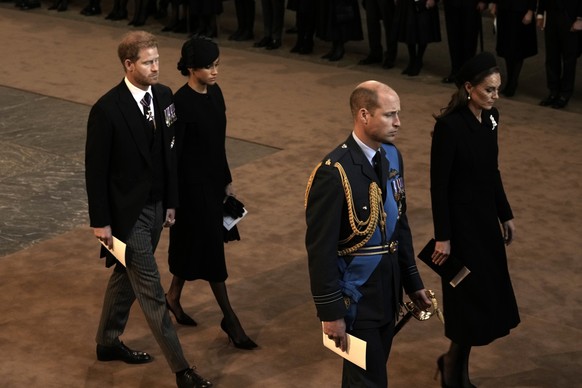 Prince Harry and Meghan, left, Duchess of Sussex, Prince William, second right, and Kate, Princess of Wales leave Westminster Hall in London, Wednesday, Sept. 14, 2022. The Queen Elizabeth II will lie ...