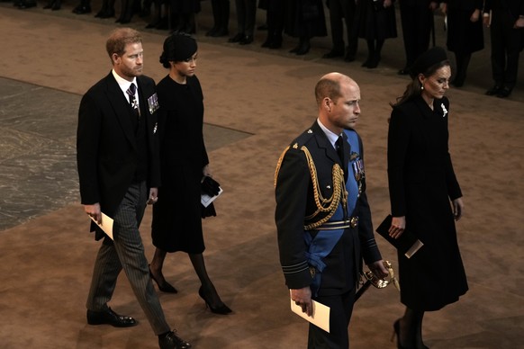 Prince Harry and Meghan, left, Duchess of Sussex, Prince William, second right, and Kate, Princess of Wales leave Westminster Hall in London, Wednesday, September 14, 2022. The Queen Elizabeth II will lie…