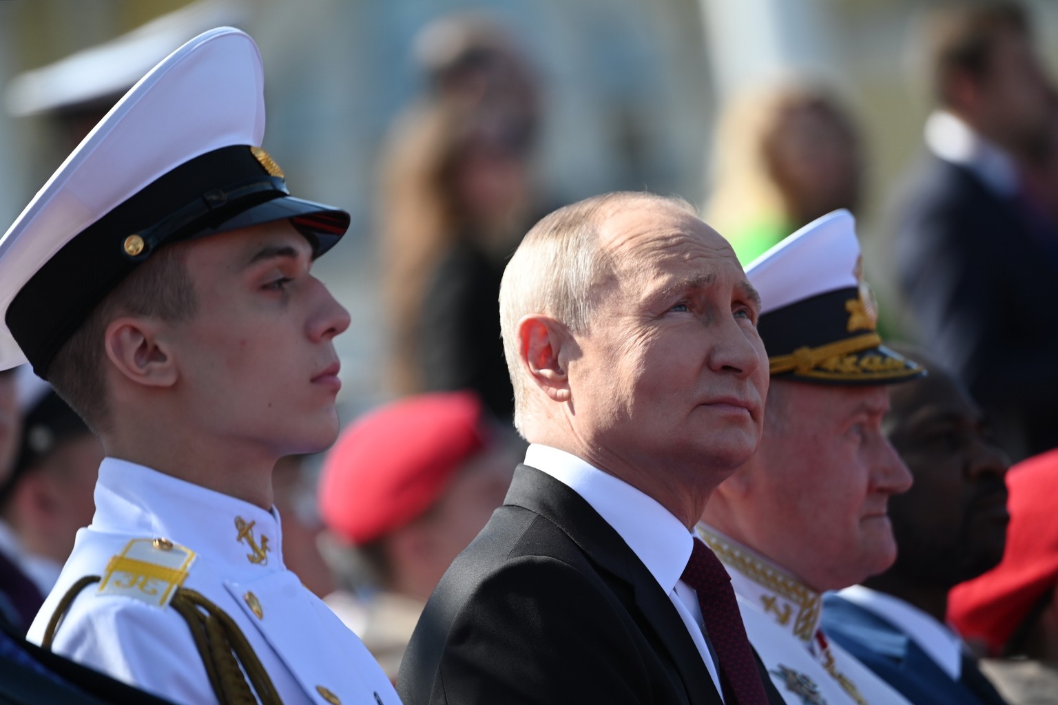 Russian President Vladimir Putin, center, watches the main naval parade marking Russian Navy Day in St. Petersburg, Russia, Sunday, July 30, 2023. (Alexander Kazakov, Sputnik, Kremlin Pool Photo via A ...