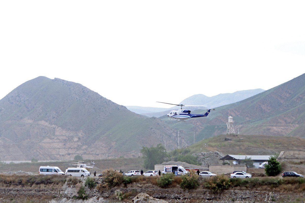 epa11353649 A handout photo made available by IRNA News Agency shows a helicopter carrying Iranian President Ebrahim Raisi taking off in Aras Iran-Azerbaijan border, southwestern Iran, 19 May 2024. Ac ...