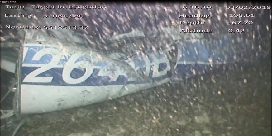 In this image released Monday Feb. 4, 2019, by the UK Air Accidents Investigation Branch (AAIB) showing the rear left side of the fuselage including part of the aircraft registration N264DB that went  ...