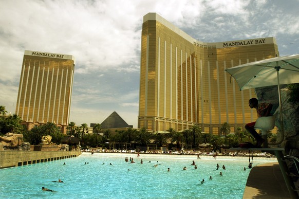 Lifeguard Keth Jackson watches over the beach wave pool at the Mandalay Bay Resort Hotel and 
Casino Wednesday, June 16, 2004 in Las Vegas. Mandalay Resort Group shareholders have said yes to MGM Mira ...