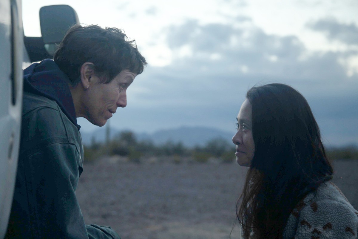 This image released by Searchlight Pictures shows Frances McDormand, left, and director Chloe Zhao on the set of "Nomadland." Zhao has made cinema of rugged authenticity, relying frequently  ...