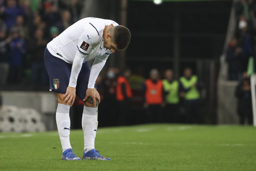 Giovanni Di Lorenzo of Italy reacts following their World Cup 2022 group C qualifying soccer match between Northern Ireland and Italy at Windsor Park stadium in Belfast, Northern Ireland, Monday, Nov. ...