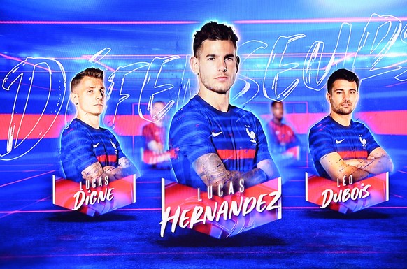 epa09209723 The portraits of France&#039;s defender Lucas Hernandez (C), France&#039;s defender Leo Dubois (R) and France&#039;s defender Lucas Digne (L) are displayed as France&#039;s head coach Didi ...