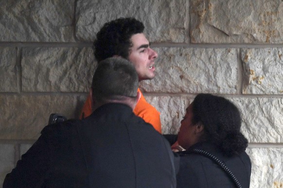 Luigi Nicholas Mangione is escorted into Blair County Courthouse, Tuesday, Dec. 10, 2024, in Hollidaysburg, Pa. (AP Photo/Gary M. Baranec)
Luigi Nicholas Mangione