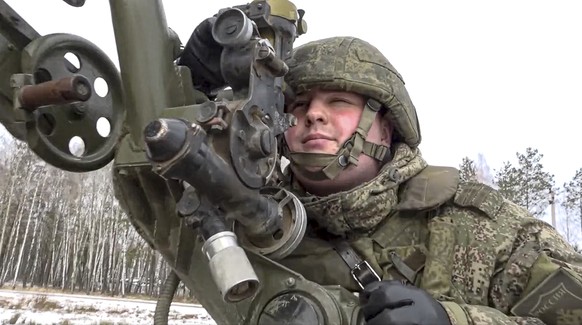 In this photo taken from video and released by the Russian Defense Ministry Press Service on Friday, Feb. 4, 2022, a soldier takes part in the Belarusian and Russian joint military drills at Brestsky  ...