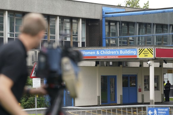 Members of the media outside the Countess of Chester Hospital in Chester, England, Friday, Aug. 18, 2023. A neonatal nurse in a British hospital has been found guilty of killing seven babies and tryin ...