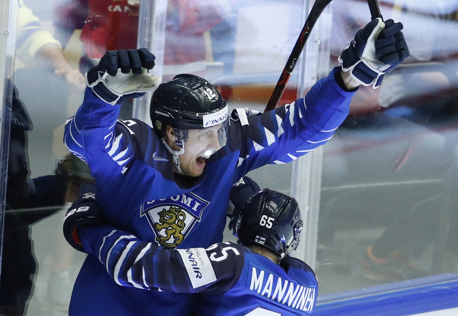 Finland&#039;s Marko Anttila, left, celebrates with teammate Sakari Manninen, right, after scoring a goal during the Ice Hockey World Championships group B match between Finland and the United States  ...