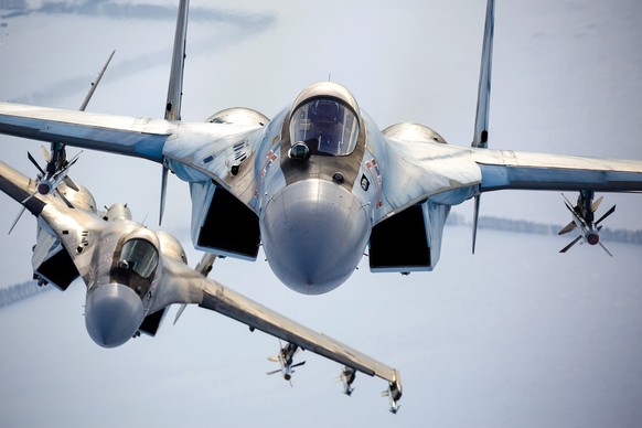 In this photo released by the Russian Defense Ministry Press Service, a pair of Russian Su-35 fighter jets fly in the sky in Russia, Sunday, Nov. 28, 2021. The Ukrainian and Western officials have exp ...