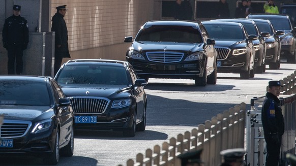 epa07268701 A vehicle (C), that is allegedly carrying North Korean leader Kim Jong-un, leaves the railway station with other cars in Beijing, China, 08 January 2019. According to media reports, North  ...