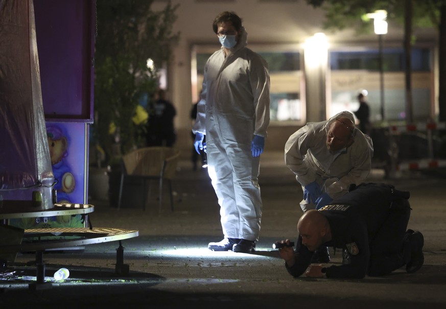 epa11562309 Forensics police officers on the scene after a Knife attack at the city festival in Solingen, Germany, 23 August 2024. According to the police, at around 9.45 pm a man stabbed passers-by a ...