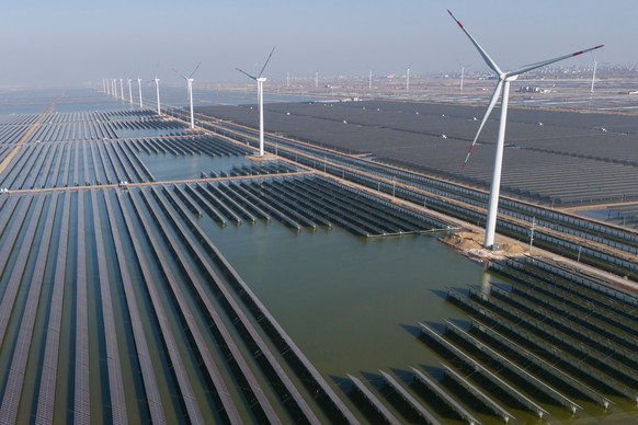 FILE - Wind turbines operate along a solar farm near Weifang in eastern China's Shandong province on March 22, 2024. (AP Photo/Ng Han Guan, File)
Iran Renewable Energy