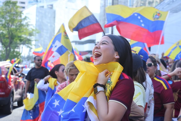 epaselect epa12624529 A Venezuelan woman residing in Panama City celebrates during a demonstration following the capture of Venezuelan President Nicolas Maduro at Urraca Park in Panama City, Panama, 0 ...