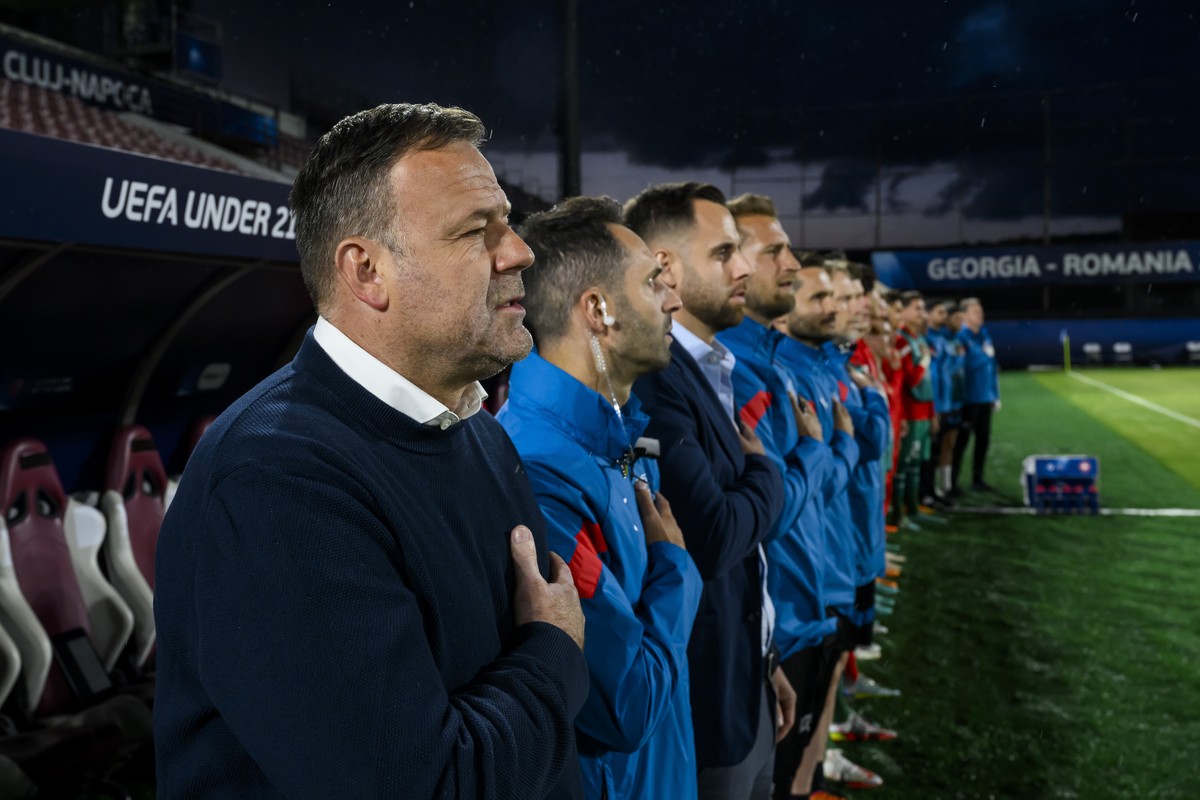 Switzerland's head coach Patrick Rahmen, left, and staff sing the national anthem during a Group D match between Switzerland and France at the 2023 UEFA European Under-21 Championship tournament  ...