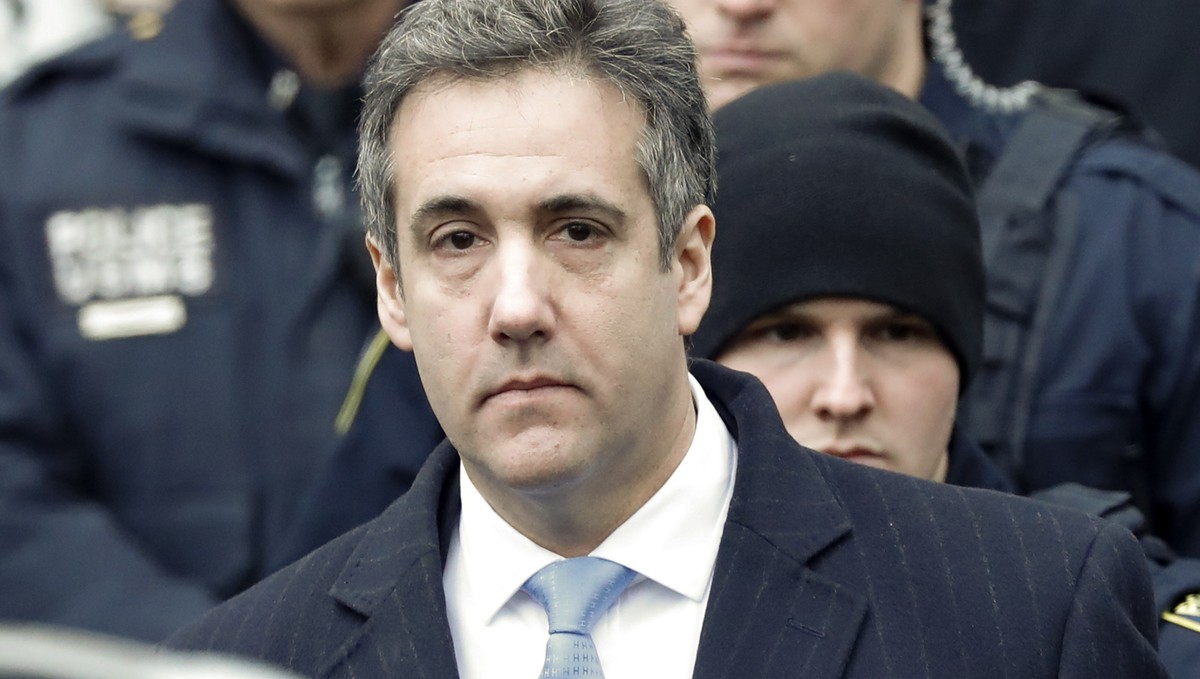 epa07226494 Michael Cohen (C), President Trump's former lawyer, departs United States Federal Court under heavy security after being sentenced to three years in prison in New York, New York, USA, ...