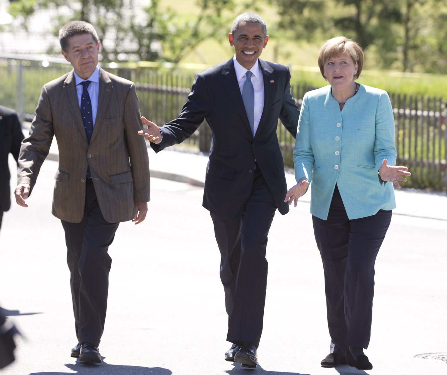 US President Barack Obama walks with German Chancellor Angela Merkel and her husband Joachim Sauer, left, as they arrive in Kruen, near Garmisch-Partenkirchen, southern Germany, Sunday, June 7, 2015,  ...