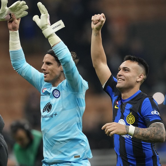 FILE - Inter Milan's Lautaro Martinez, center, and Inter Milan's goalkeeper Yann Sommer celebrate after the end of the Serie A soccer match between Inter Milan and Atalanta at the San Siro S ...