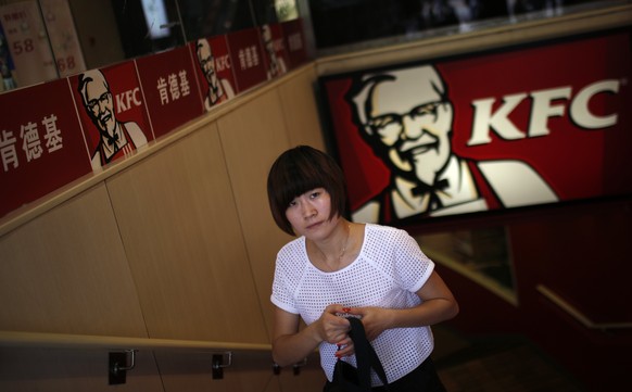 A customer walks out of a KFC store in downtown Shanghai July 31, 2014. A food safety scare in China is testing local consumers&#039; loyalty to foreign fast-food brands, including McDonald&#039;s Cor ...