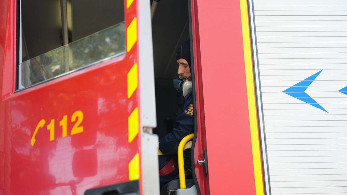 A firefighter rests inside a fire engine in San Martin de Valdeiglesias, west of Madrid, Spain, where wildfires have forced tens of thousands to be evacuated, Sunday, July 26, 2026. (AP Photo/Manu Fer ...