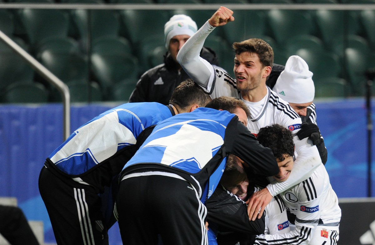 Legia's Thibault Moulin celebrates with his teammates after scoring goal during the Champions League Group F soccer match between Legia Warsaw and Real Madrid, at Stadion Wojska Polskiego, in War ...