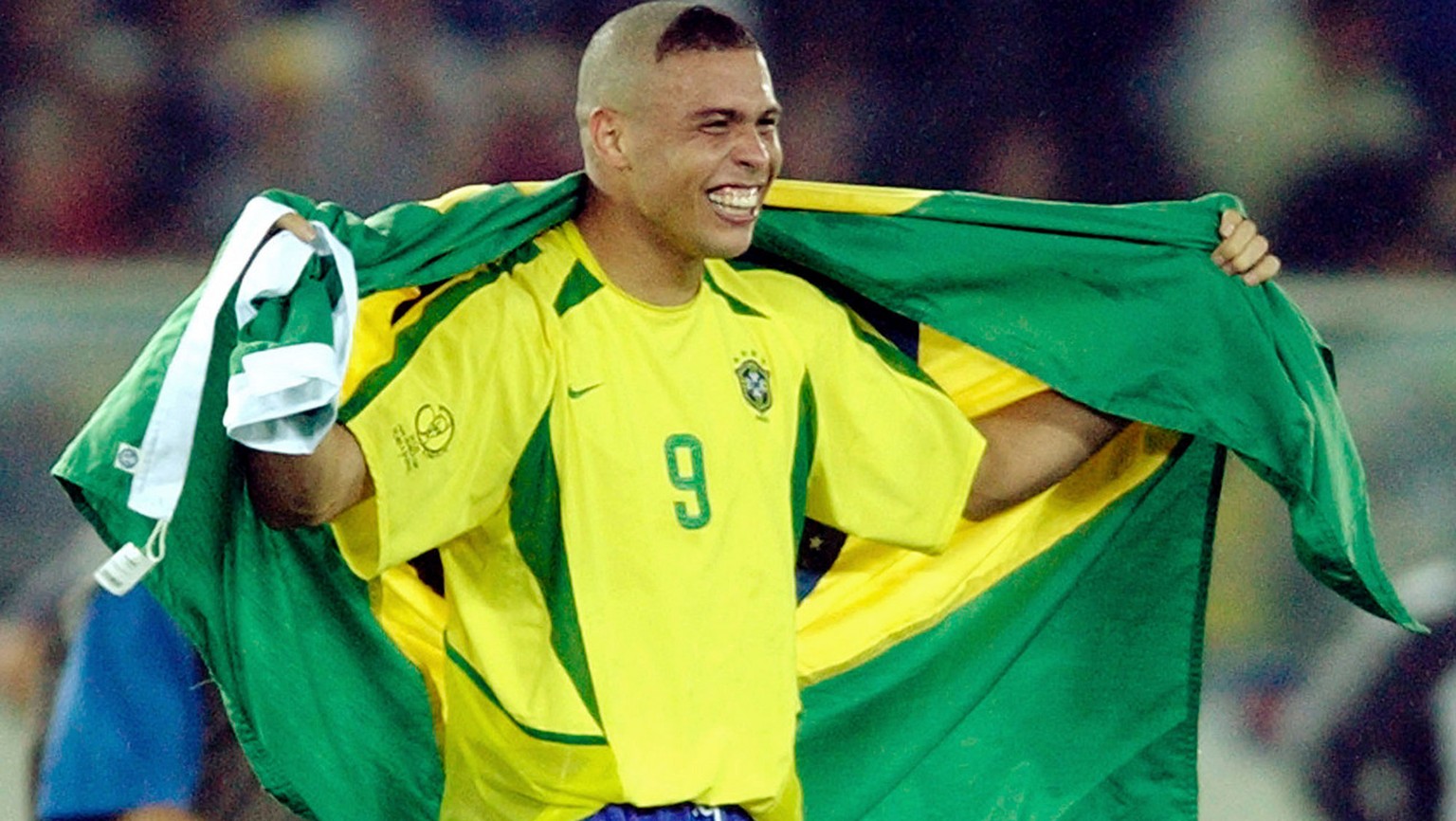 Brazil forward Ronaldo celebrates with the Brazilian flag after they defeated Germany 2-0 in the 2002 World Cup final Sunday, June 30, 2002 in Yokohama, Japan. (AP Photo/Amy Sancetta)