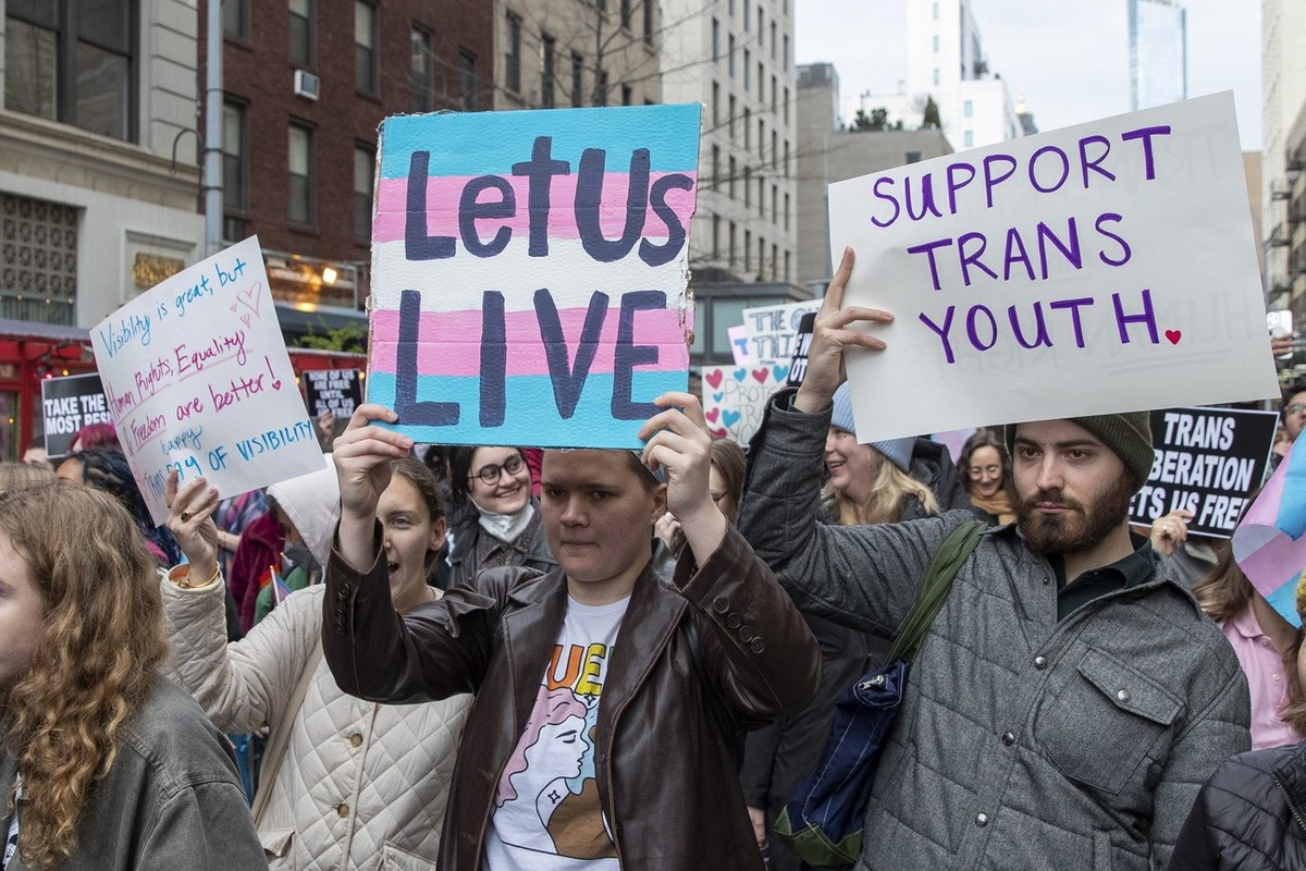 epa10553084 People march to show their support for the Transgender community on Trans Visibility Day during a rally in New York, New York, USA, 31 March 2023. Trans Visibility Day is an annual event d ...