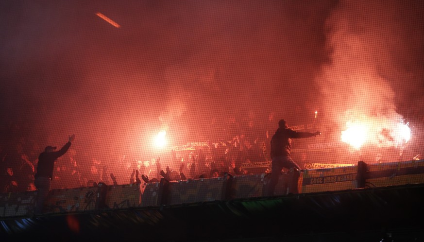 Soccer fans set off flares during a Europa League group G soccer match between Feyenoord and Young Boys at De Kuip stadium in Rotterdam, Netherlands, Thursday, Nov. 7, 2019. (AP Photo/Peter Dejong)