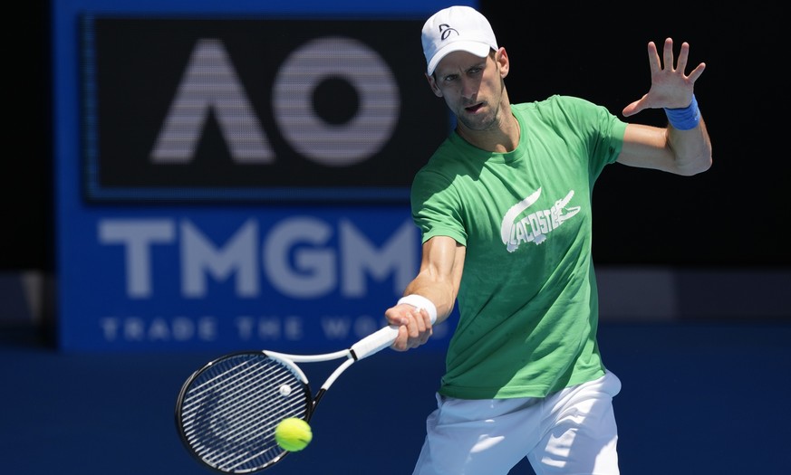 FILE - Defending men&#039;s champion Serbia&#039;s Novak Djokovic practices on Margaret Court Arena ahead of the Australian Open tennis championship in Melbourne, Australia, Thursday, Jan. 13, 2022. A ...