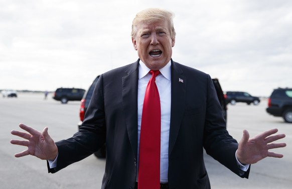 President Donald Trump speaks to media before boarding Air Force One, Sunday, March 24, 2019, at Palm Beach International Airport, in West Palm Beach, Fla., en route to Washington. (AP Photo/Carolyn K ...