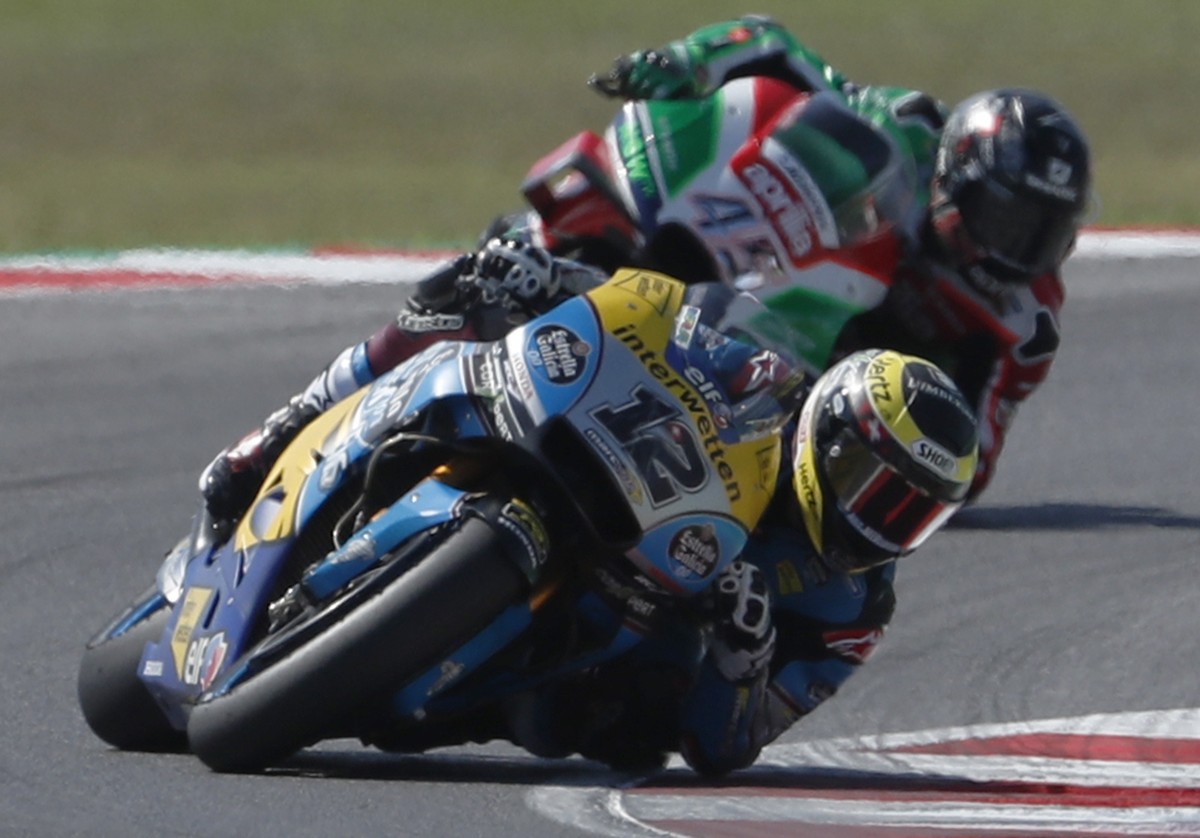 Switzerland's Thomas Luthi leads Britain's Scott Redding during the San Marino Motorcycle Grand Prix at the Misano circuit in Misano Adriatico, Italy, Sunday, Sept. 9, 2018. (AP Photo/Antoni ...