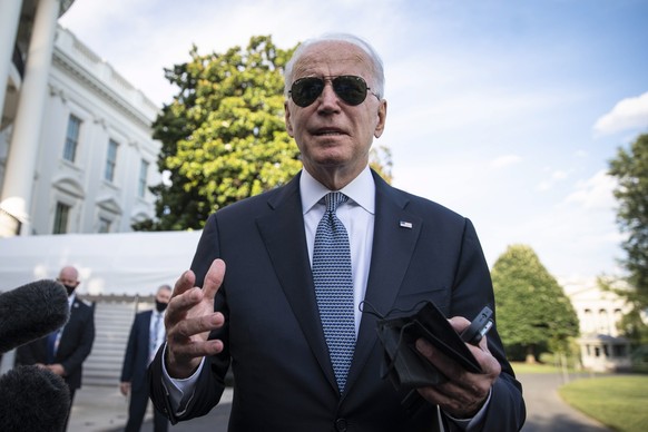 epa09380709 US President Joe Biden speaks to reporters outside of the White House in Washington, DC, USA, 30 July 2021, before boarding Marine One for a weekend at Camp David. EPA/SARAH SILBIGER / POO ...