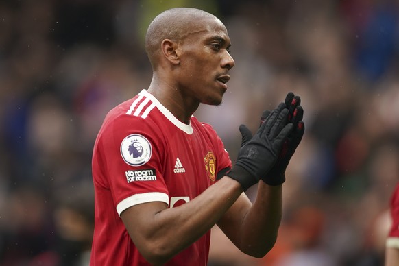 Manchester United's Anthony Martial applauds fan as he walks off the pitch at half-time, during the English Premier League soccer match between Manchester United and Everton, at Old Trafford, Manchester, England, Saturday, Oct. 2, 2021. (Dave Thompson, Pool via AP)