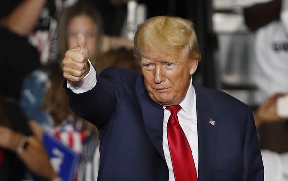 epa10190825 Former US President Donald Trump gestures during a Save America rally at the Covelli Centre in Youngstown, Ohio, USA, 17 September 2022. EPA/DAVID MAXWELL