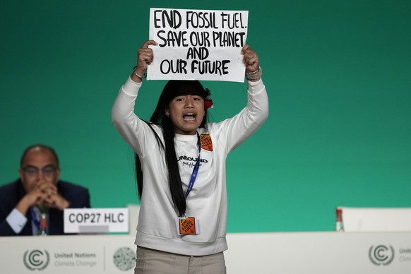 A demonstrator protests against the use of fossil fuels during an event at the COP28 U.N. Climate Summit, Monday, Dec. 11, 2023, in Dubai, United Arab Emirates. (AP Photo/Rafiq Maqbool)